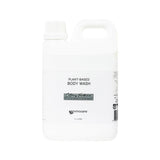 Image shows a white plastic 2 litre container in a jerrycan shape . The container has a screwtop and is labelled Plant Based Body Wash Citrus Verbena Envirocare 2 litres